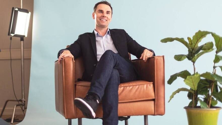 Brendon Burchard sitting on a chair